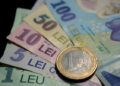 Leul s-a depreciat față de euro, dar a crescut comparativ cu dolarul american!